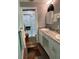 Updated bathroom featuring dual sinks, marble countertops, and a walk-in shower at 1601 43Rd N St # 226, St Petersburg, FL 33713