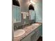 Updated bathroom featuring dual sinks, marble countertops, and modern fixtures at 1601 43Rd N St # 226, St Petersburg, FL 33713