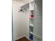 Organized closet with shelving and hanging space behind a louvered door at 1601 43Rd N St # 226, St Petersburg, FL 33713