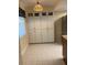 Kitchen with tile floors, pantry, and dark countertops at 1601 43Rd N St # 226, St Petersburg, FL 33713