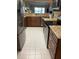 Well-maintained kitchen featuring stainless steel appliances, granite countertops, and tile flooring at 1601 43Rd N St # 226, St Petersburg, FL 33713