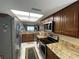 Well-lit kitchen with stainless steel appliances and granite countertops at 1601 43Rd N St # 226, St Petersburg, FL 33713