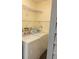 Functional laundry room with washer, dryer, and shelving for storage at 1601 43Rd N St # 226, St Petersburg, FL 33713