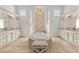 Luxurious bathroom showcasing a large soaking tub, vanity, and elegant chandelier at 16312 Palmettoglen Ct, Lithia, FL 33547