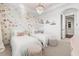 Bedroom featuring floral wallpaper, twin beds, window and neutral carpet at 16312 Palmettoglen Ct, Lithia, FL 33547