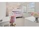 room features a bunk bed, desk, chair, wallpaper and lots of natural light at 16312 Palmettoglen Ct, Lithia, FL 33547