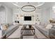 A large living room with a coffered ceiling, built-ins, and neutral decor at 16312 Palmettoglen Ct, Lithia, FL 33547