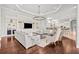 Spacious living room with hardwood floors, a coffered ceiling and neutral decor at 16312 Palmettoglen Ct, Lithia, FL 33547