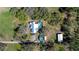 Sprawling property showcasing a pool, outbuildings, mature trees, and a private setting at 16349 Spring Valley Rd, Dade City, FL 33523