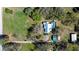 Overhead view of the property, showcasing the home, pool, and outbuildings at 16349 Spring Valley Rd, Dade City, FL 33523