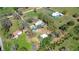 Extensive aerial view captures the home, outbuildings, and neighborhood layout at 16349 Spring Valley Rd, Dade City, FL 33523