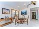 Elegant dining area with marble floors, ornate wood furniture and decorative artwork at 16349 Spring Valley Rd, Dade City, FL 33523