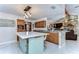 Spacious kitchen with a large island, wooden cabinets and granite countertops at 16349 Spring Valley Rd, Dade City, FL 33523