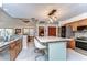 Well-appointed kitchen featuring a large island, stainless steel appliances, and granite countertops at 16349 Spring Valley Rd, Dade City, FL 33523