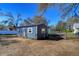 Charming outbuilding with windows, door, and a small porch at 16349 Spring Valley Rd, Dade City, FL 33523