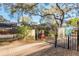 Gated community entrance with signage, lush landscaping, and secured access for residents' peace of mind at 1712 Hammock Pine Blvd # 1712, Clearwater, FL 33761
