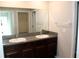 Double sink bathroom vanity with granite countertop at 17152 Sunshine Mimosa St, Wimauma, FL 33598