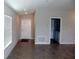 Open-concept living space featuring ceramic tile and ample natural light from the front window at 17152 Sunshine Mimosa St, Wimauma, FL 33598