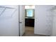 View from closet to bathroom with double sink vanity at 17152 Sunshine Mimosa St, Wimauma, FL 33598