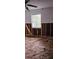 Bedroom featuring hardwood floors, a window with natural light, and partially exposed frame walls at 1743 Maryland Ne Ave, St Petersburg, FL 33703