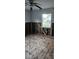 Bedroom exhibiting hardwood floors, a well-lit window, and unfinished frame walls at 1743 Maryland Ne Ave, St Petersburg, FL 33703