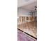 Living room under construction, featuring hardwood floors and exposed beams, ready for personalization at 1743 Maryland Ne Ave, St Petersburg, FL 33703