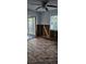 Spacious living room with hardwood floors, a sliding glass door, and unfinished walls awaiting transformation at 1743 Maryland Ne Ave, St Petersburg, FL 33703