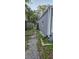 Side yard featuring a walkway and green space at 1743 Maryland Ne Ave, St Petersburg, FL 33703