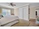 Bedroom featuring closet with sliding doors, neutral walls, and a ceiling fan at 1771 Macdonnell Dr, Palm Harbor, FL 34684