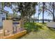 Backyard lawn area with a waterfront view at 18715 Lakeshore Dr, Lutz, FL 33549