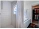 Bright bathroom featuring a bathtub with white tile and shower at 18715 Lakeshore Dr, Lutz, FL 33549