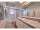 Bathroom with double sink vanity and tile flooring at 18715 Lakeshore Dr, Lutz, FL 33549