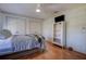 Bedroom featuring hardwood floors, and two large closets at 18715 Lakeshore Dr, Lutz, FL 33549