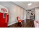 Vintage themed den with retro coca-cola machine, wood flooring, jukebox and chair at 18715 Lakeshore Dr, Lutz, FL 33549