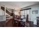 Charming dining room with classic decor, hardwood floors, and a view of the staircase at 18715 Lakeshore Dr, Lutz, FL 33549