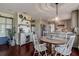 Open-concept dining area features stylish coffee bar, stainless appliances, and seating for four at the round table at 18715 Lakeshore Dr, Lutz, FL 33549