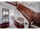 Open Foyer with stairway and bench seating; view into dining room at 18715 Lakeshore Dr, Lutz, FL 33549