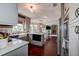 Modern kitchen with stainless steel appliances, island, eat-in area and opening to Gathering room at 18715 Lakeshore Dr, Lutz, FL 33549