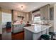 Well-lit kitchen with custom cabinets, stainless appliances, butcher block countertops, and barstool seating at 18715 Lakeshore Dr, Lutz, FL 33549