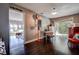 Charming office space with vintage decor and sliding glass doors to the backyard, dark wood flooring, and ample lighting at 18715 Lakeshore Dr, Lutz, FL 33549