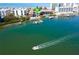 Aerial shot features waterfront condos, private boat docks, and convenient beach access at 19937 Gulf Blvd # B-3, Indian Shores, FL 33785