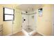 Bright bathroom boasting a glass shower with modern fixtures and tiled walls at 19937 Gulf Blvd # B-3, Indian Shores, FL 33785