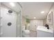 Modern bathroom features updated fixtures, a sleek glass shower, a vanity, and fresh decor for a comfortable experience at 19937 Gulf Blvd # B-3, Indian Shores, FL 33785