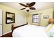Bright bedroom with hardwood floors, ceiling fan, and ample closet space at 19937 Gulf Blvd # B-3, Indian Shores, FL 33785