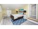 Beautiful bedroom featuring a queen bed, stylish decor, and ample natural light, creating a relaxing ambiance at 19937 Gulf Blvd # B-3, Indian Shores, FL 33785