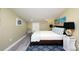 Beautiful bedroom featuring a queen bed, stylish decor, and ample natural light, creating a relaxing ambiance at 19937 Gulf Blvd # B-3, Indian Shores, FL 33785