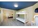 Bright bedroom featuring bunk beds with easy access to the other bedroom, providing a cozy retreat at 19937 Gulf Blvd # B-3, Indian Shores, FL 33785