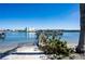 View of the waterfront docks accessible from this property with clear blue skies above at 19937 Gulf Blvd # B-3, Indian Shores, FL 33785
