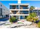 Multi-story condo featuring stone accents and private balconies overlooking the waterfront at 19937 Gulf Blvd # B-3, Indian Shores, FL 33785