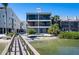 Waterfront home featuring multiple balconies and a scenic view from the pier at 19937 Gulf Blvd # B-3, Indian Shores, FL 33785